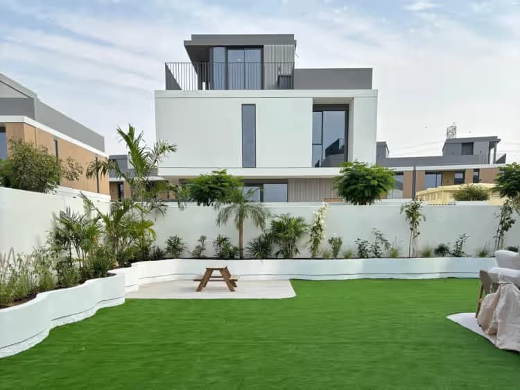 Villa backyard landscape design with turf and planters
